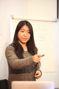 Answer the question Chinese teacher pointing at her student