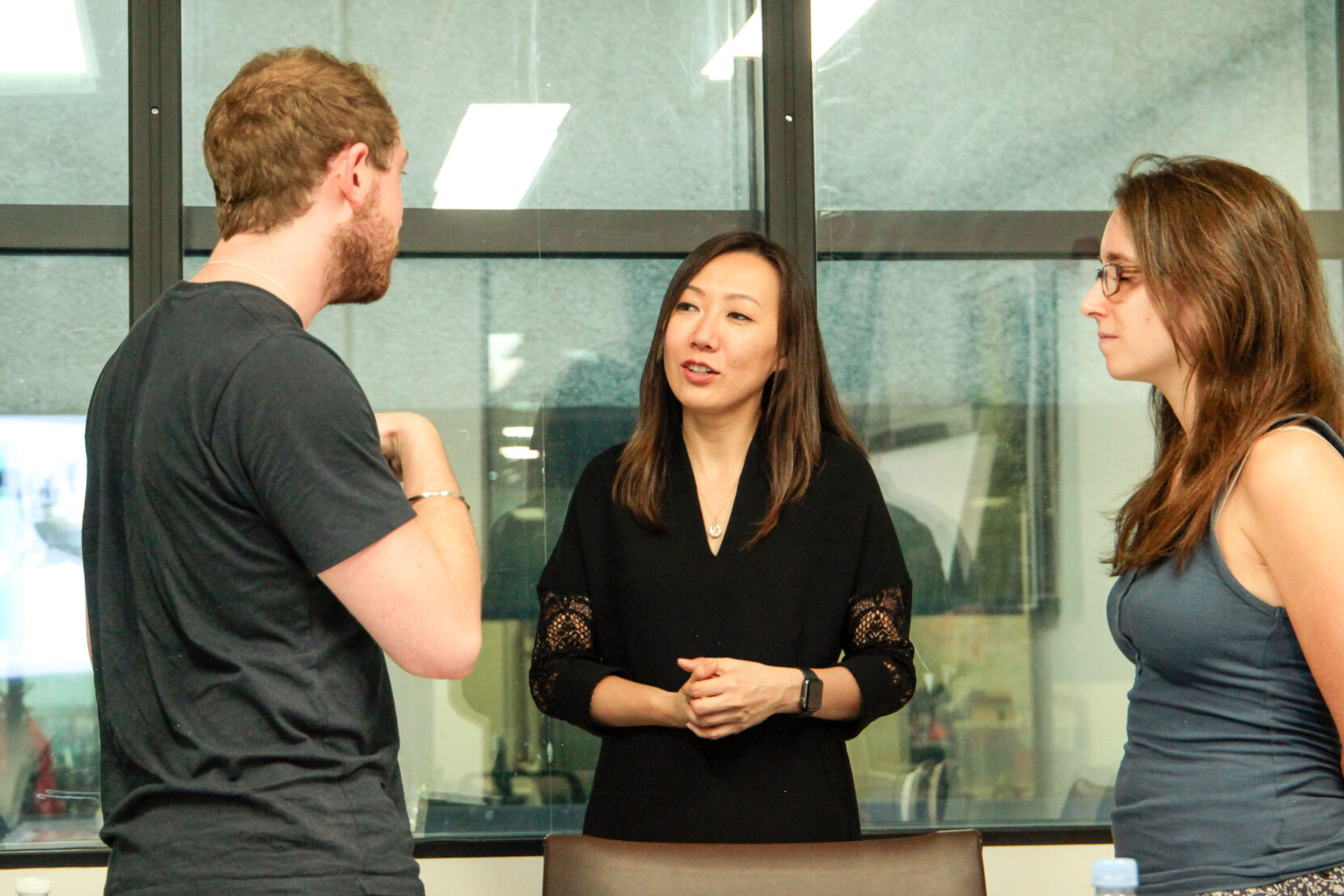 A teacher discussing with two students