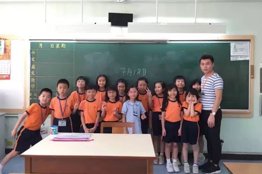Practical Mandarin Teacher Marcus with his little students in class